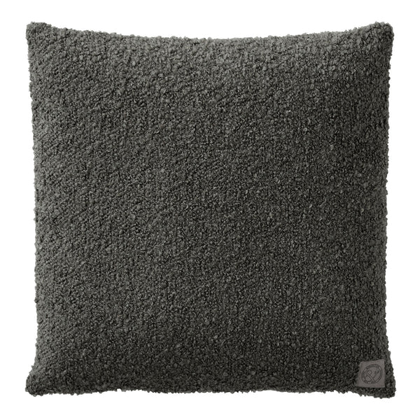 Textured dark gray throw pillow with a plush, fuzzy surface, ideal for modern interior decor.
