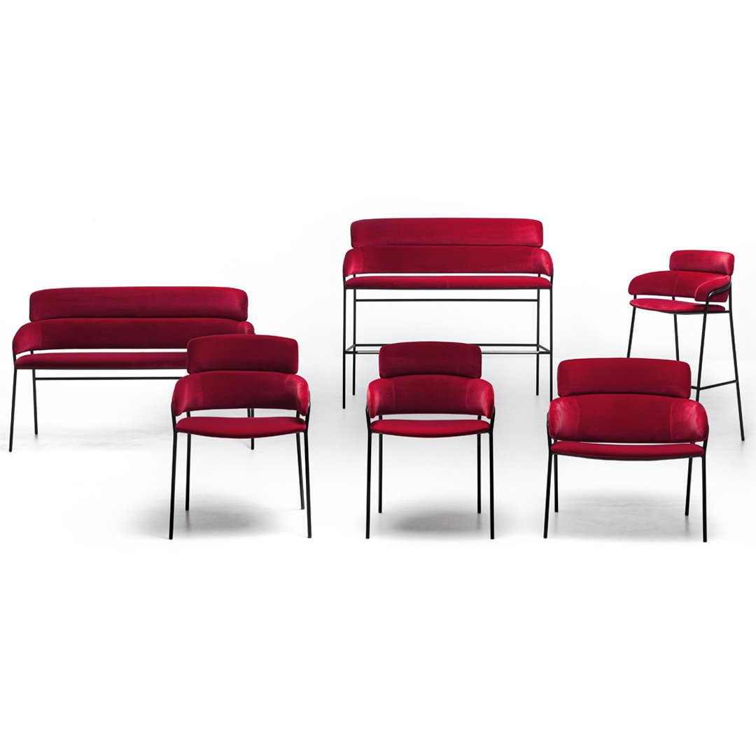 Red upholstered seating set with sleek black legs, featuring smooth textures and modern designs. Perfect for stylish interiors.
