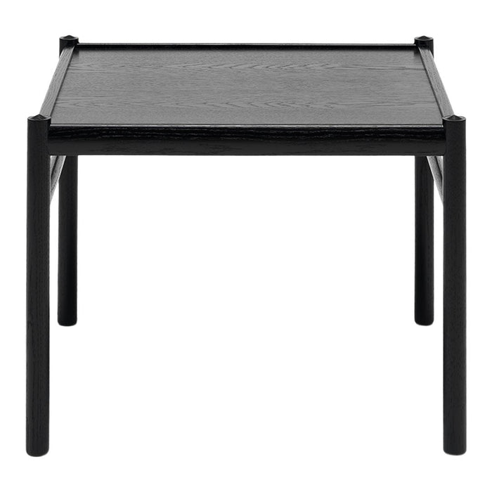 Black square table with a smooth finish and sleek, minimalist design. Perfect for modern interiors.