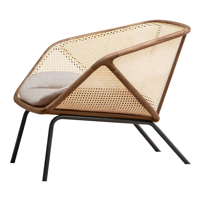 "Modern beige and brown lounge chair with geometric cane pattern and soft cushion, set on sleek black legs."