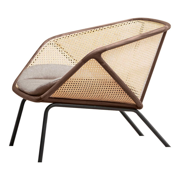 Brown and natural rattan armchair with a modern design and soft fabric cushion; sleek black metal legs.