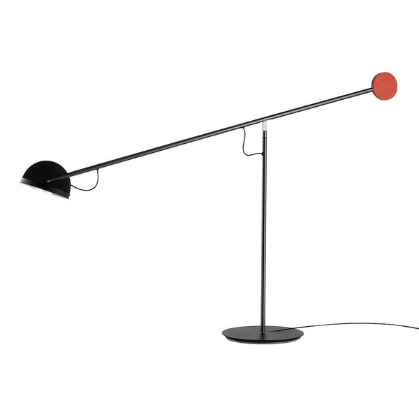 Black and red modern lamp with geometric design, featuring a round red accent and sleek, minimalist lines.