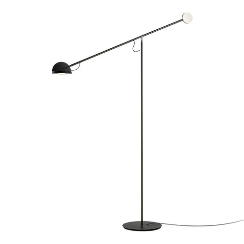 Modern black and white floor lamp with a sleek, minimal design and geometric shapes.