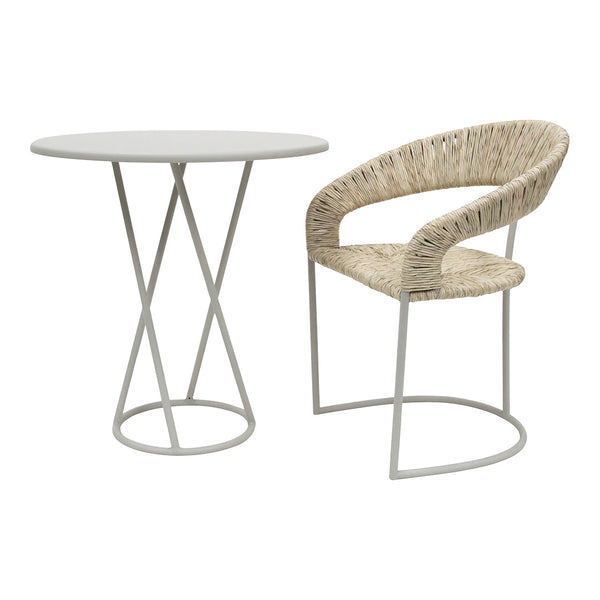 White circular table paired with a beige woven chair featuring a sleek metal frame and natural textures.