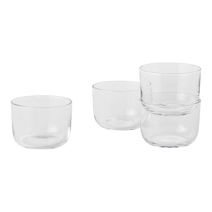 Clear glass bowls in a simple, modern design with smooth surfaces, showcasing a minimalist aesthetic.