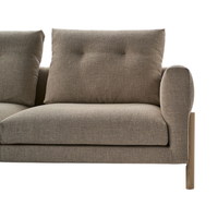 Neutral gray sofa with tufted cushions and a sleek wooden frame, ideal for modern living spaces.