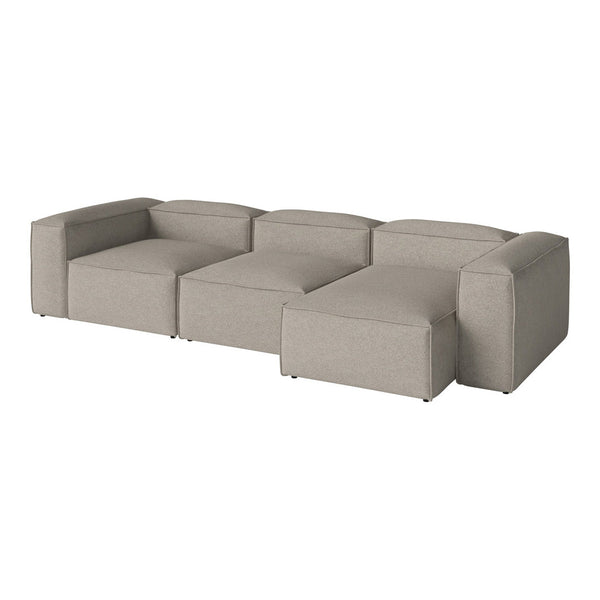 Light beige sectional sofa with a modern, minimalist design and soft, textured fabric upholstery.