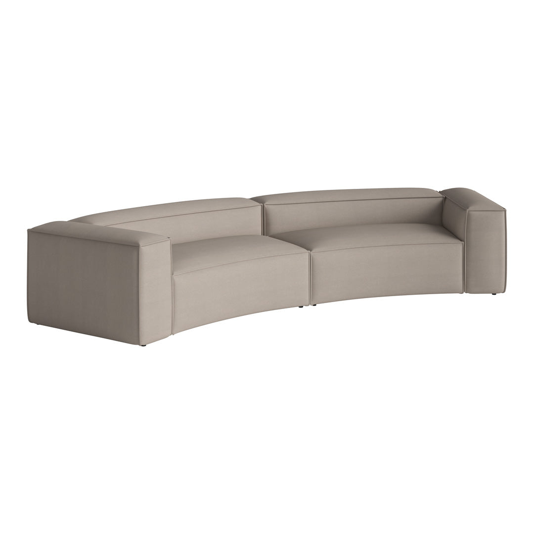 Curved sofa in soft beige upholstery with a minimalist design and no visible patterns. Perfect for modern spaces.
