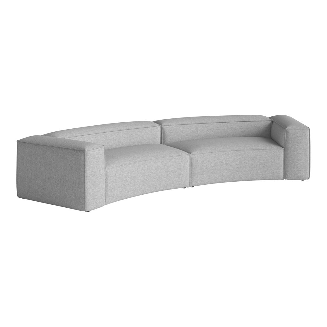 Gray curved sectional sofa with a smooth, textured fabric, featuring modern minimalist design and seamless color pattern.
