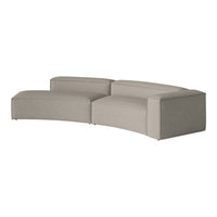 Modern curved sofa in a soft, neutral beige fabric with a smooth texture and minimalist design.
