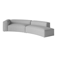 Gray modular sofa with a sleek, curved design and textured fabric upholstery for modern interiors.