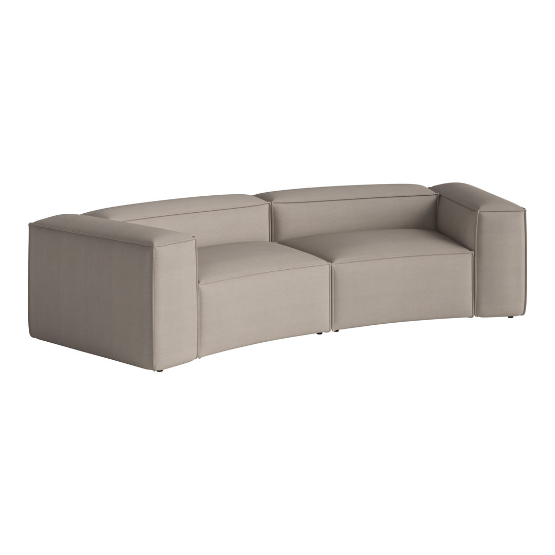 Curved beige sofa with smooth upholstery, featuring a minimalist design and subtle texture, ideal for modern decor.