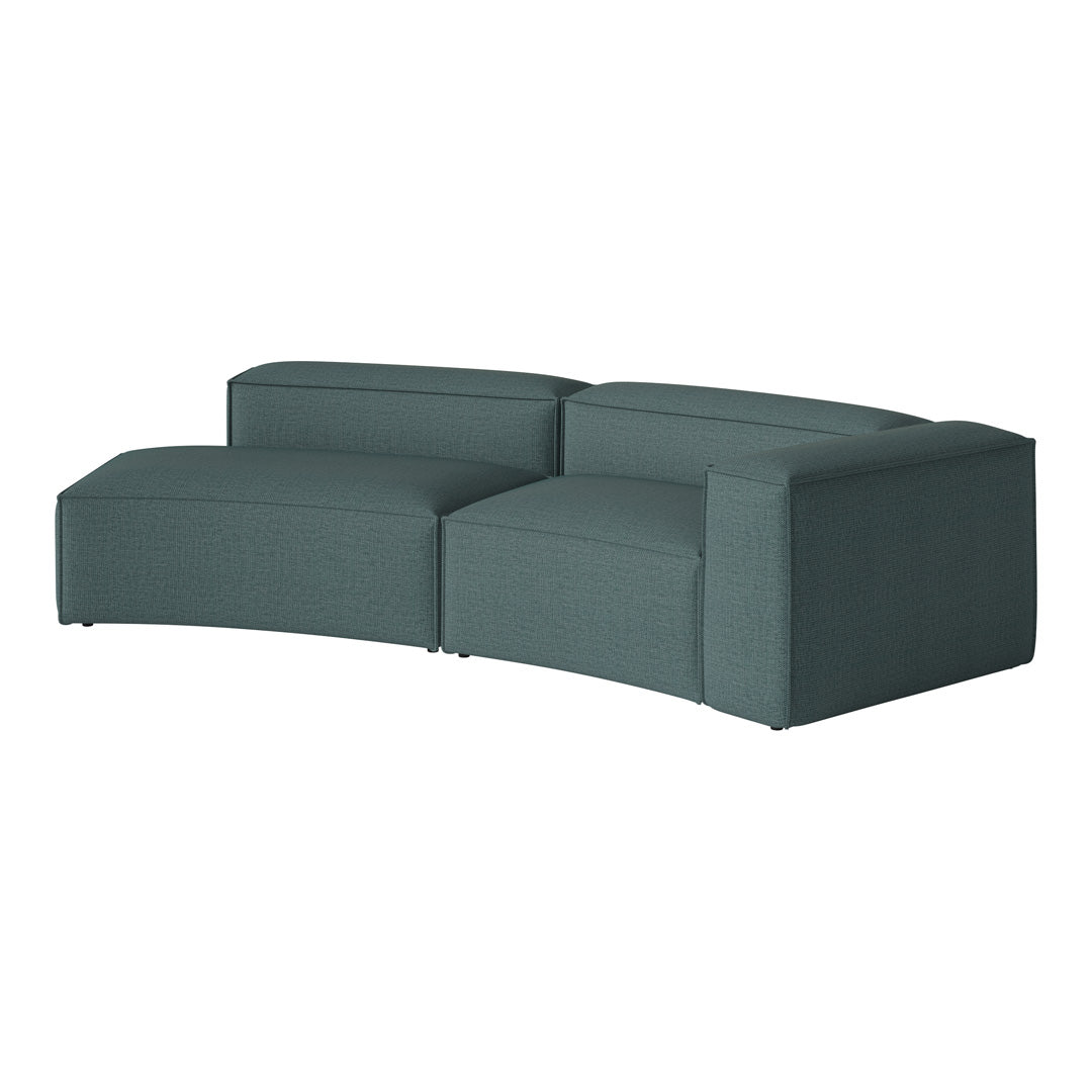 Curved teal sofa with a textured fabric pattern, perfect for modern living spaces. Elegant and versatile design.