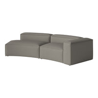 Curved grey sofa with a textured fabric finish, featuring a minimalist design and soft, muted tones.