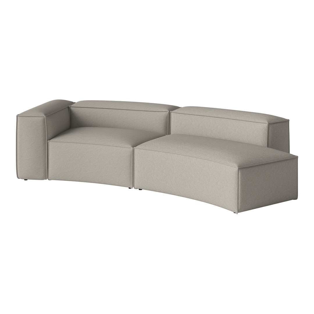 Gray modular sofa with a smooth, textured fabric and contemporary curved design, perfect for modern living spaces.