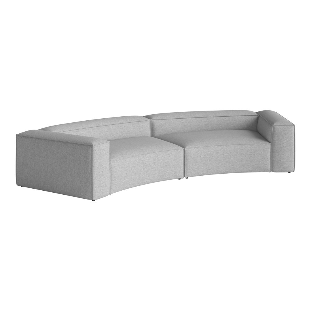 Curved sofa in light gray fabric with a subtle textured pattern, offering a modern aesthetic for any living space.