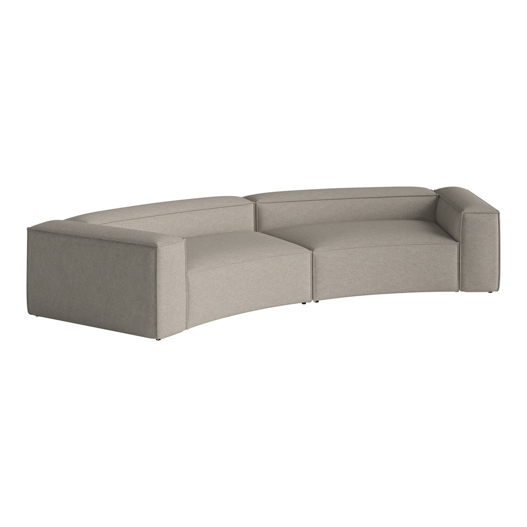 Curved sectional sofa in light gray fabric with a smooth, modern design and minimalist aesthetic.