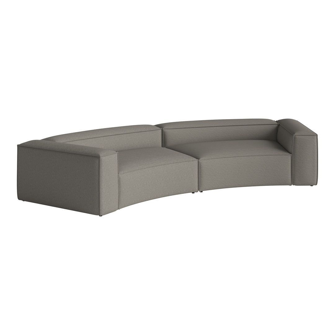 Curved sectional sofa in soft gray fabric with a modern, minimalist design and no visible patterns.