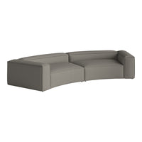Curved sectional sofa in soft gray fabric with a modern, minimalist design and no visible patterns.