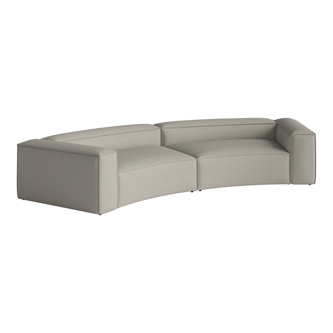 Light gray curved sofa with a minimalist design and textured fabric. Perfect for modern living spaces.
