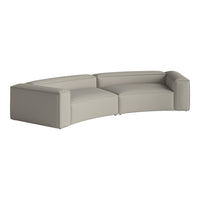 Light gray curved sofa with a minimalist design and textured fabric. Perfect for modern living spaces.