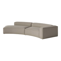 Curved sectional sofa in soft beige fabric with subtle textured pattern for a modern living space.