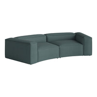 Curved teal modular sofa with textured fabric, perfect for modern living spaces.
