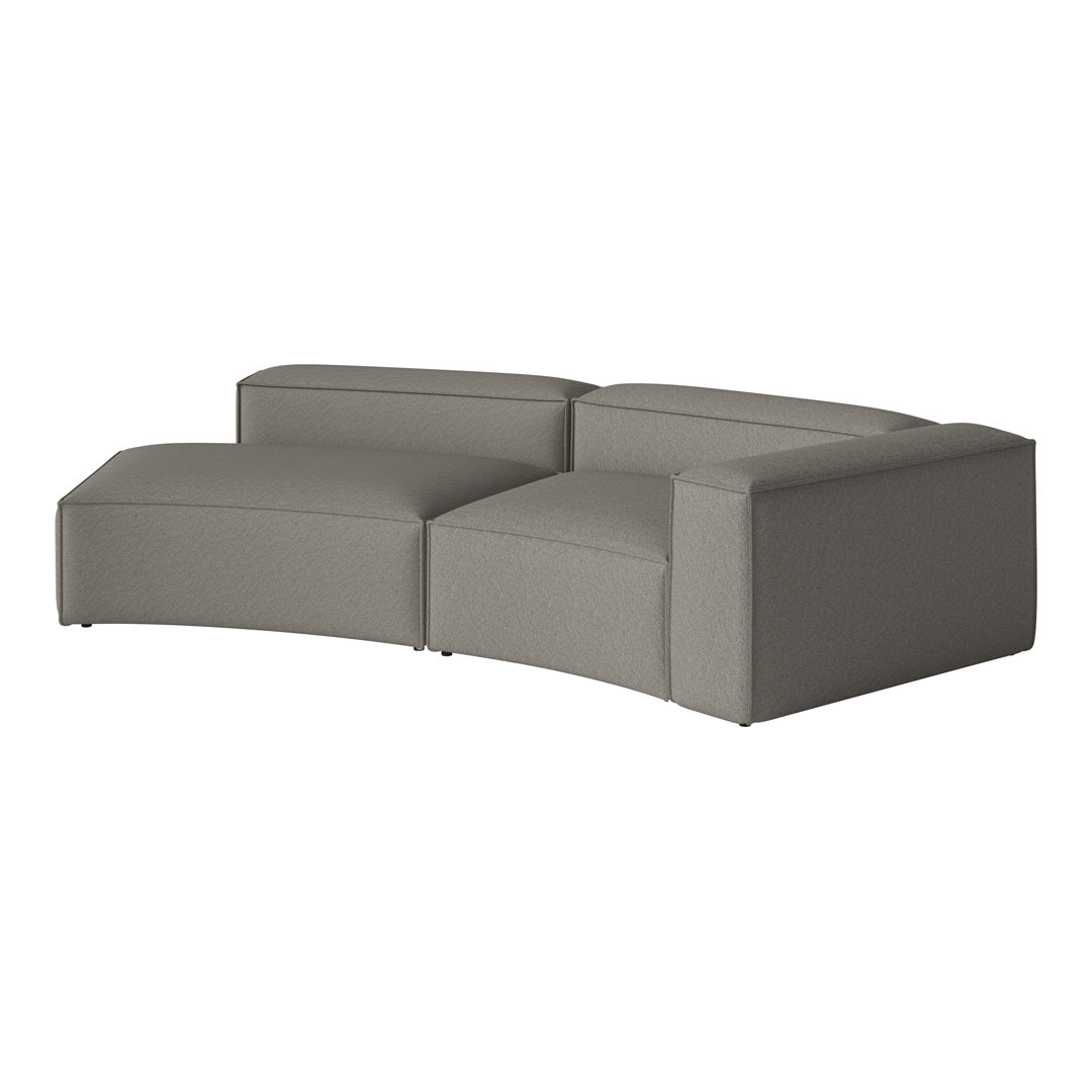 Curved modern sectional sofa in a soft light grey fabric with subtle texture and minimalist design.