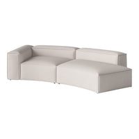 Light beige modern sectional sofa with smooth, minimalist design and soft, textured upholstery. 