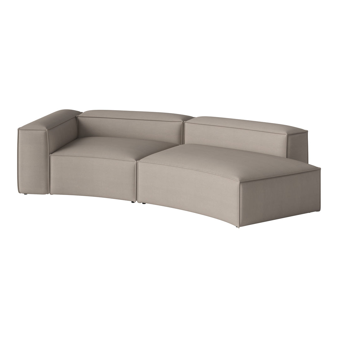 Beige curved sectional sofa with clean lines and smooth fabric texture, perfect for modern living spaces.