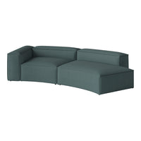 Teal modular sectional sofa with a subtle textured fabric and smooth, curved lines for a modern look.