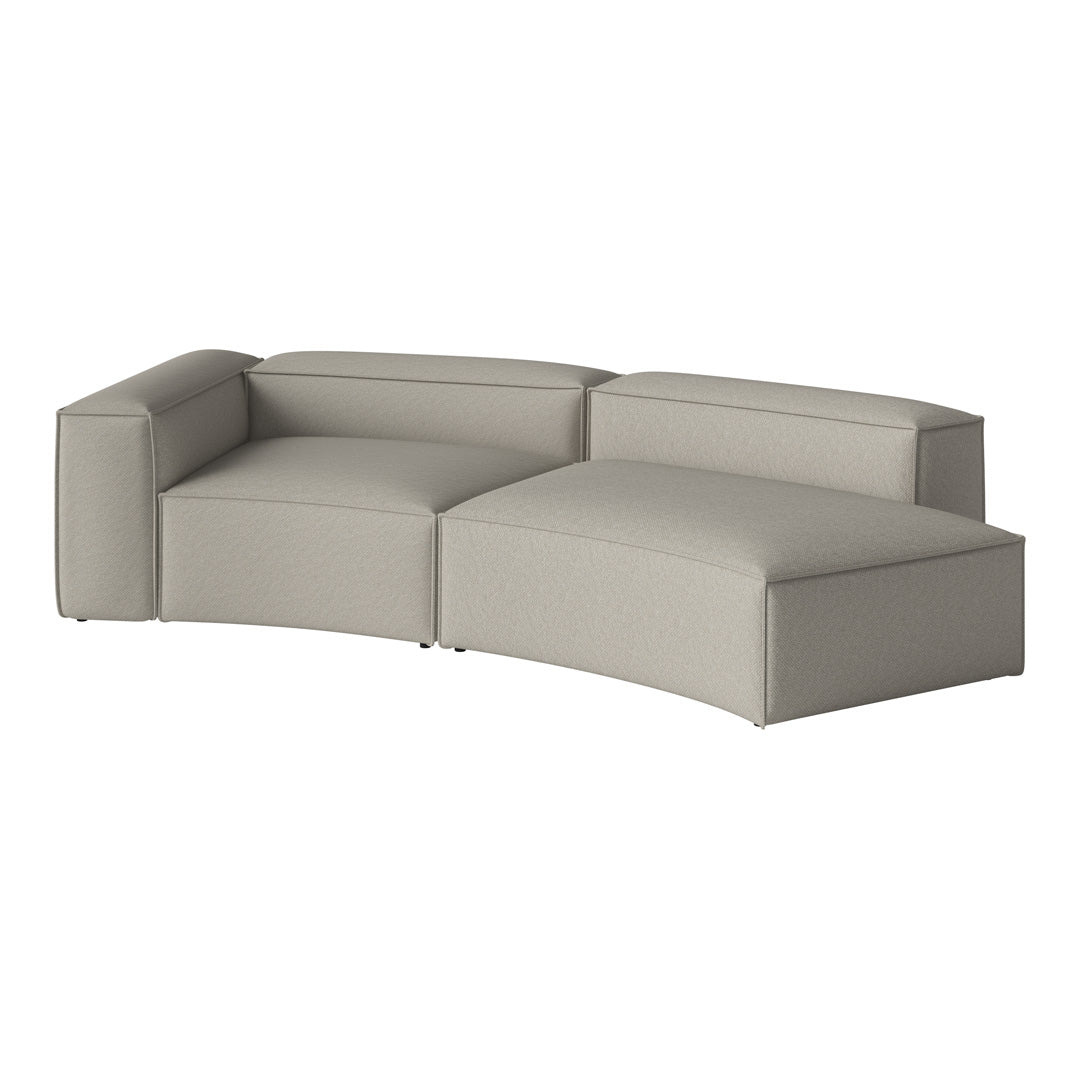 Light gray sectional sofa with a smooth, minimalist design and soft, textured upholstery.