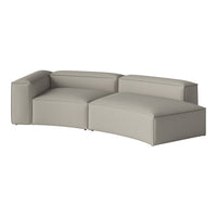 Light gray sectional sofa with a smooth, minimalist design and soft, textured upholstery.