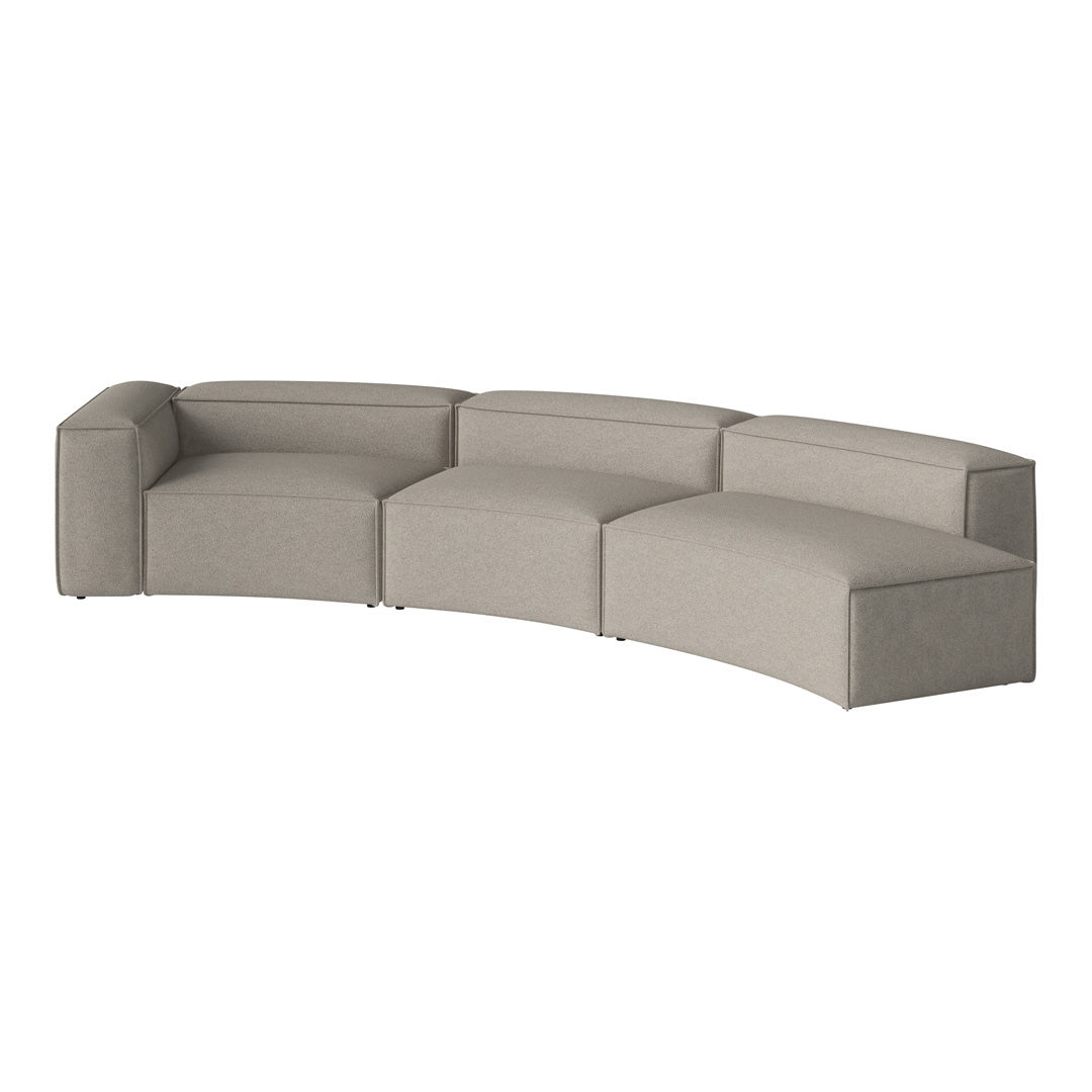 "Curved modular sofa in soft gray fabric with a smooth, modern finish, perfect for contemporary interiors."