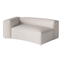 Light beige curved couch with smooth texture and minimalistic design, perfect for modern living spaces.