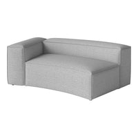 Gray upholstered sectional sofa with a smooth, modern texture and minimalist design.