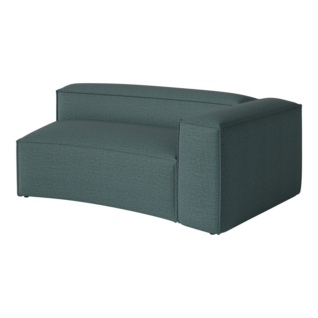 Teal curved sofa with textured fabric and seamless design, perfect for modern living spaces.