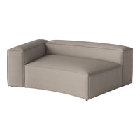 Curved sectional sofa in soft beige fabric with a smooth texture and minimalist design. Perfect for modern interiors.