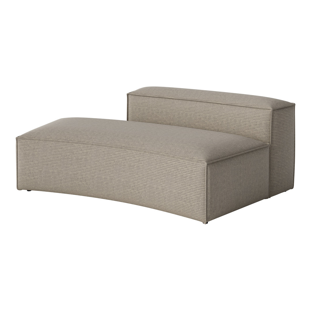 Beige upholstered chaise lounge with subtle vertical ribbed pattern and smooth curved edges. Ideal for modern decor.