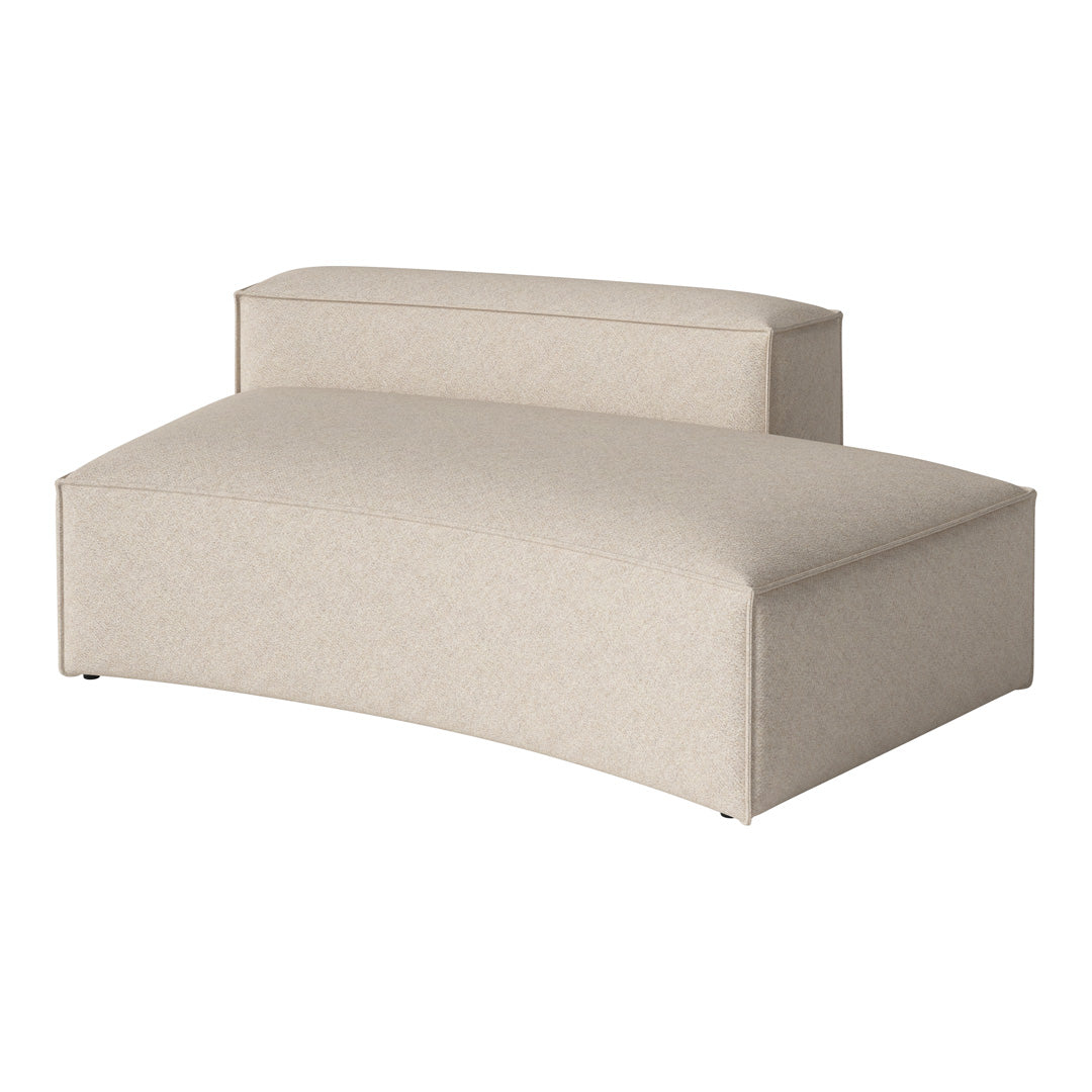Beige upholstered lounge chair with a textured pattern, featuring a smooth, curved design. Ideal for modern decor.