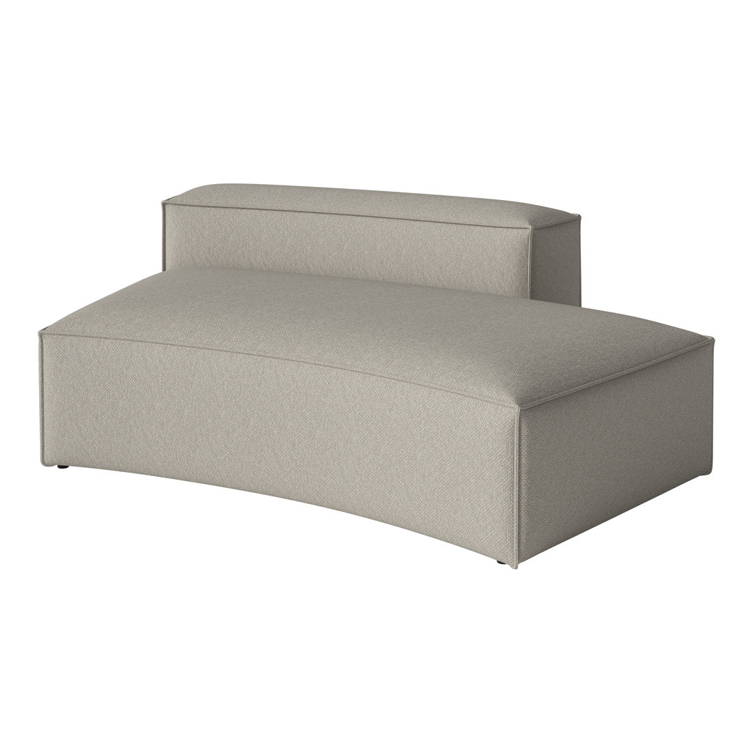 Curved sofa in a soft beige fabric with a textured pattern, ideal for modern decor.