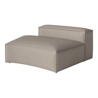Soft beige lounge chair with a smooth, minimalist design and subtle textured fabric. Perfect for modern decor.