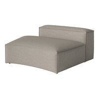 Gray upholstered chaise lounge with a smooth, minimalist design and subtle textured fabric. Perfect for modern decor.