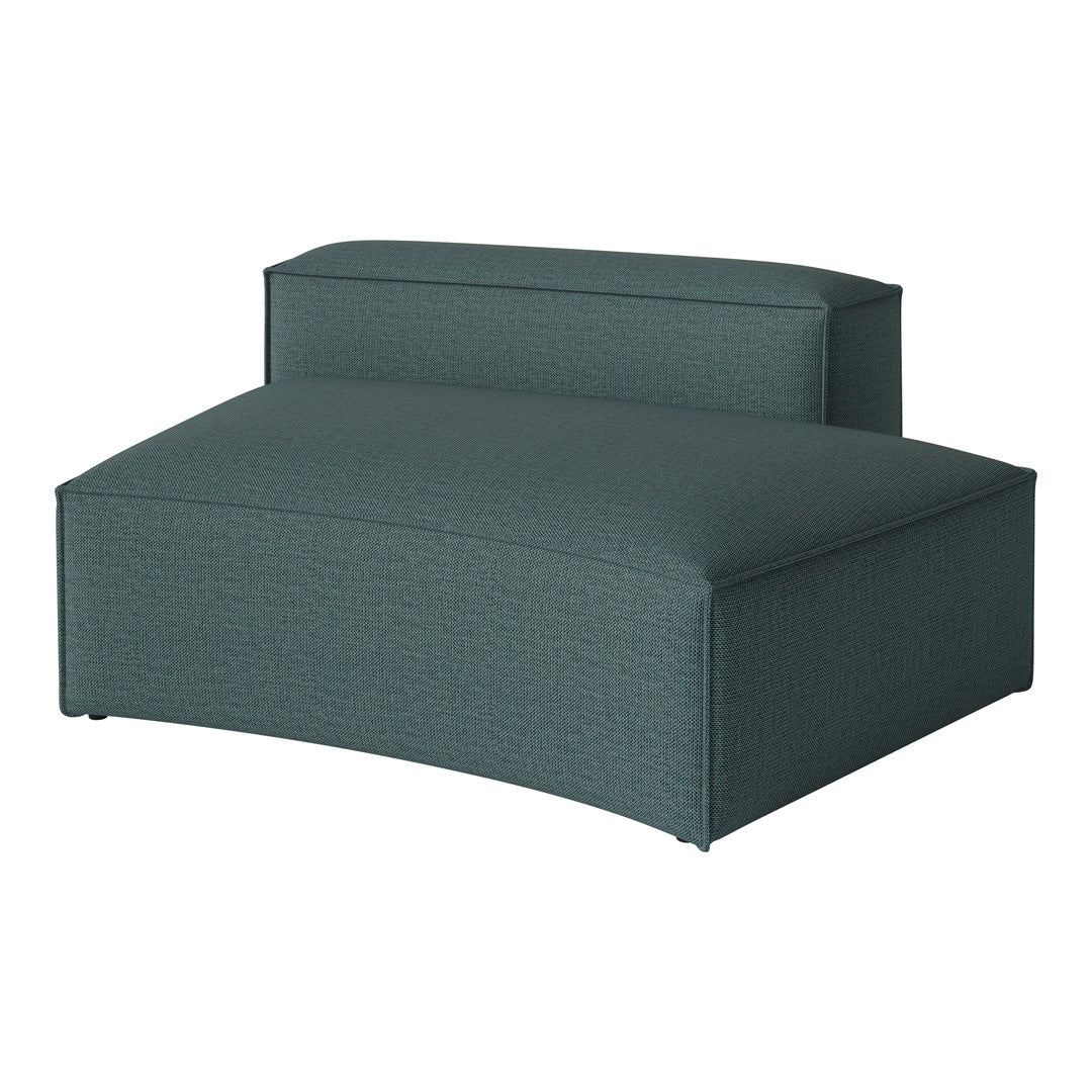 Teal curved lounge chair with a subtle textured pattern, offering a modern and stylish accent for any space.