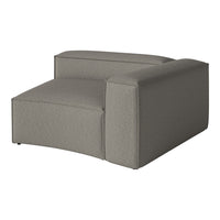 Gray armchair with a textured pattern, featuring a modern design and a sleek, minimalist silhouette.