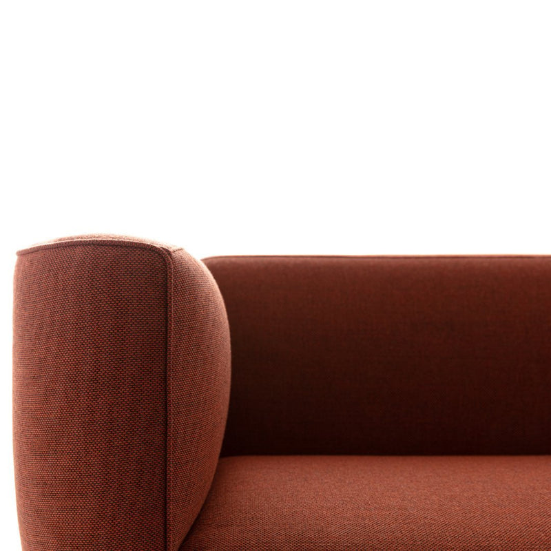 Rust-colored modern sofa with a textured fabric and smooth, rounded armrest design. Perfect for contemporary decor.