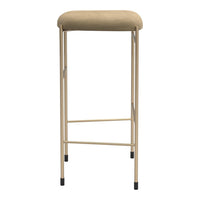 Beige cushioned stool with a sleek gold frame and black feet. Modern minimalist design. Perfect for any decor.