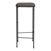 Gray upholstered bar stool with a sleek black metal frame, featuring a minimalist design and no intricate patterns.