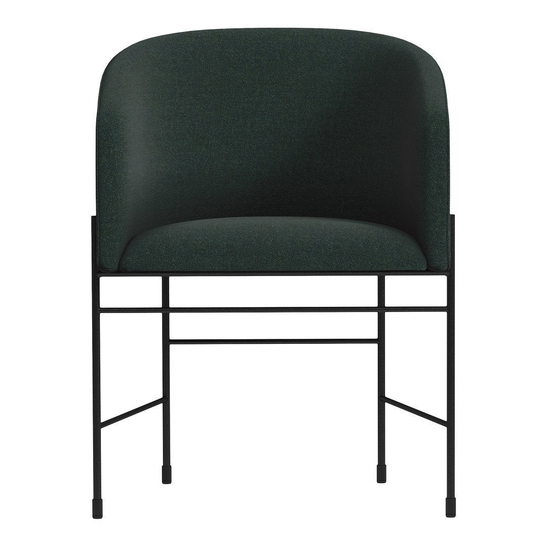 Green upholstered chair with a smooth finish and a minimalist black metal frame. Perfect for modern decor.