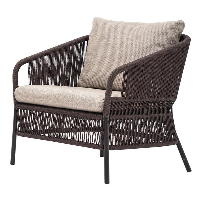 Brown wicker chair with a textured pattern and a light beige cushion. Perfect for outdoor or indoor relaxation.